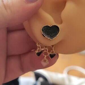 Glittery gold and black dangling heart post earrings